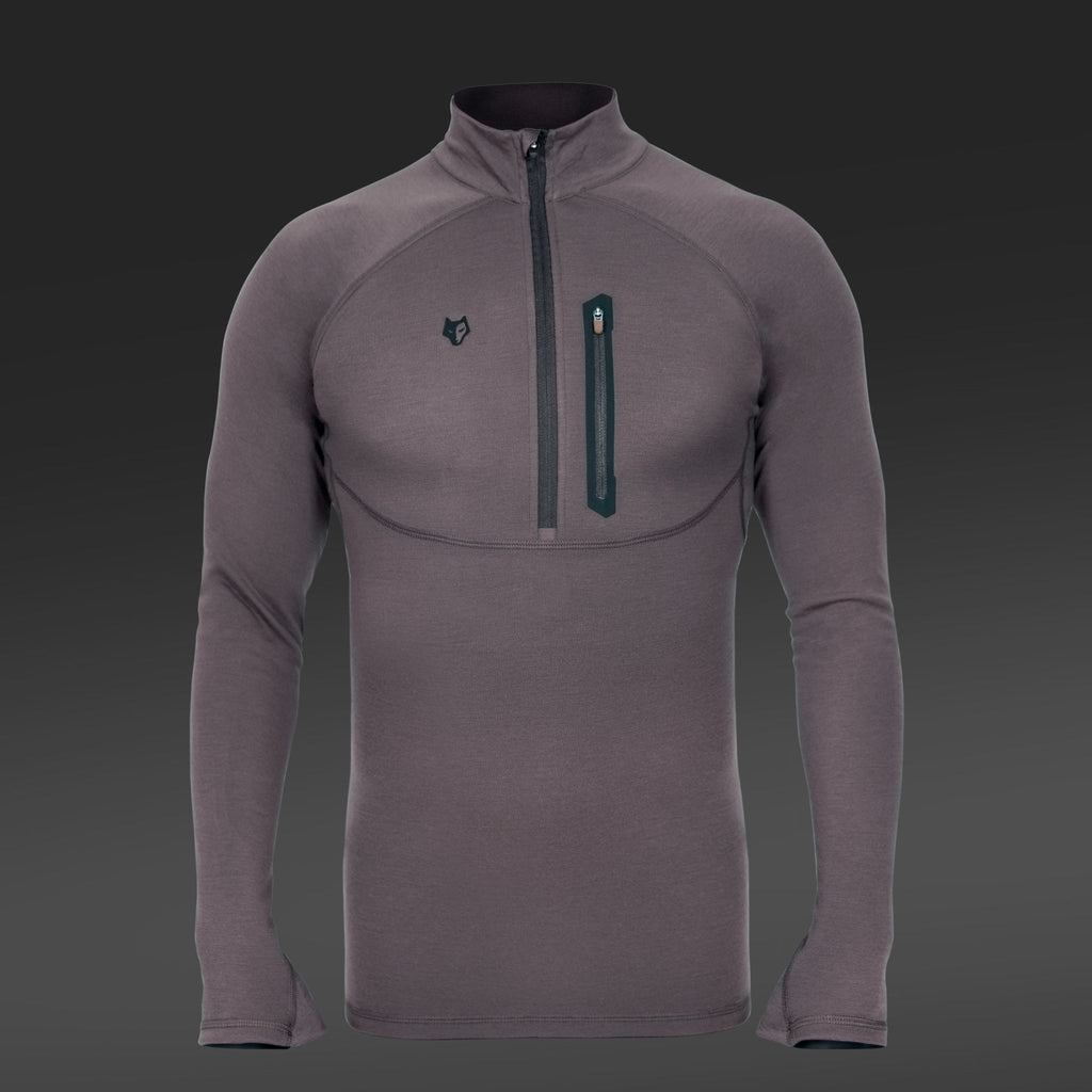 The Hillman 2BL Merino Wool Base Layer-Hunting Long Sleeve Thermal T-shirt in gray features Bamboo-Merino Technology, a high collar with front zipper, and a chest zippered pocket, ideal for hunting. Displayed on a dark gradient background.